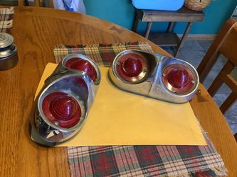 vintage 1958 Chevrolet Impala/Biscayne rear taillight assembly featuring dual red lenses set in a chrome housing.