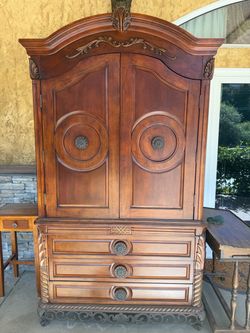 Large Wood Armoire with Carved Details