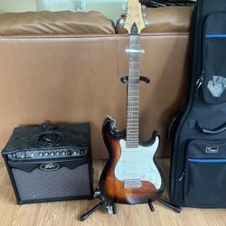 Greg Bennet Signature Series Samick electric guitar with Peavey amp, soft case, stand, strap, cord, and capo. Virtually never used!