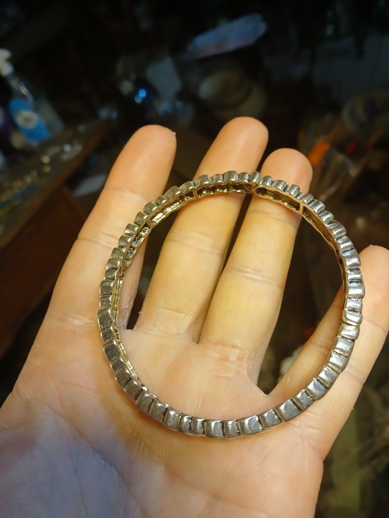 Premier Designs silver-tone herringbone or arrowhead style stretch bracelet. 
