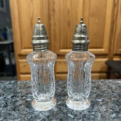 Vintage Fifth Avenue Crystal Salt and Pepper Shakers . Size approximately 5 inches tall. Preowned never used. The tags are on the bottom