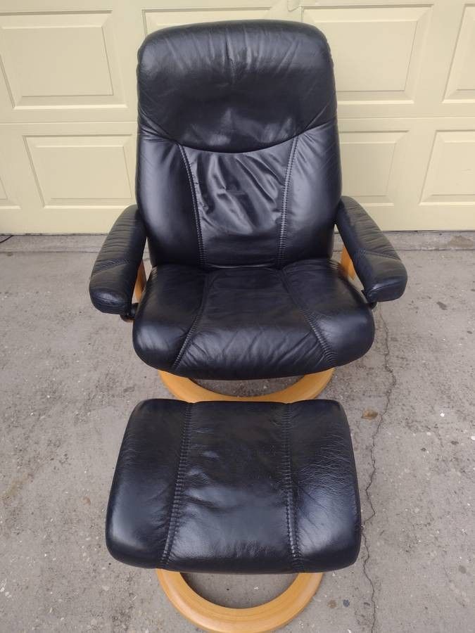 BLACK EKORNES STRESSLESS RECLINER AND OTTOMAN