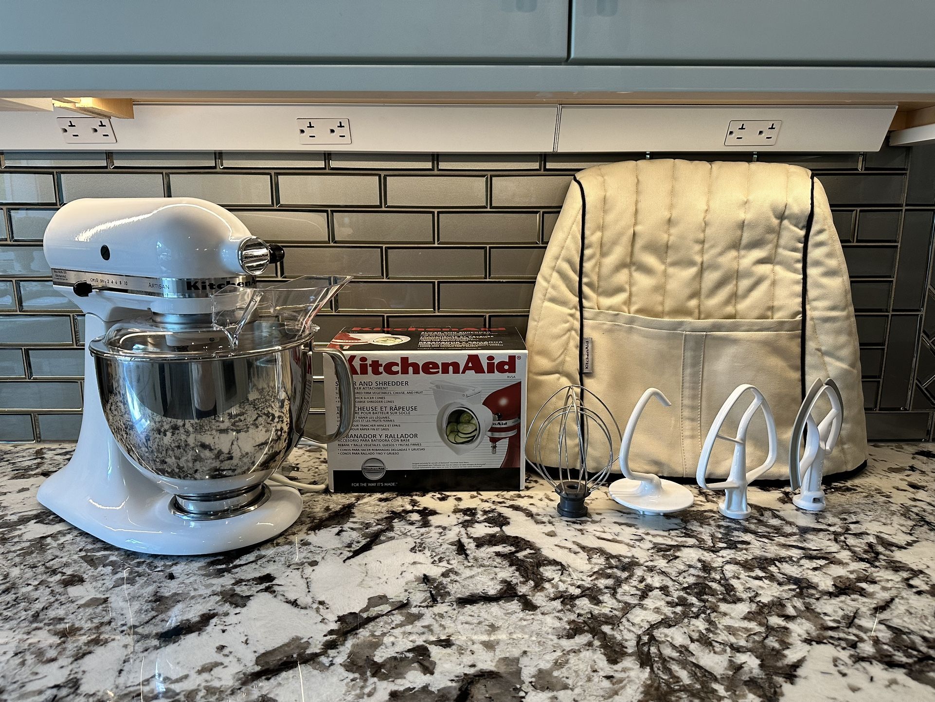 KitchenAid artisan stand mixer with five attachments and cover