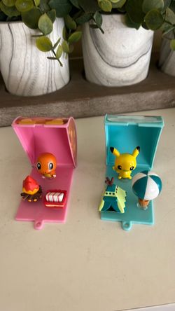 Two Pokémon Polly pockets with tiny figures used but in good condition