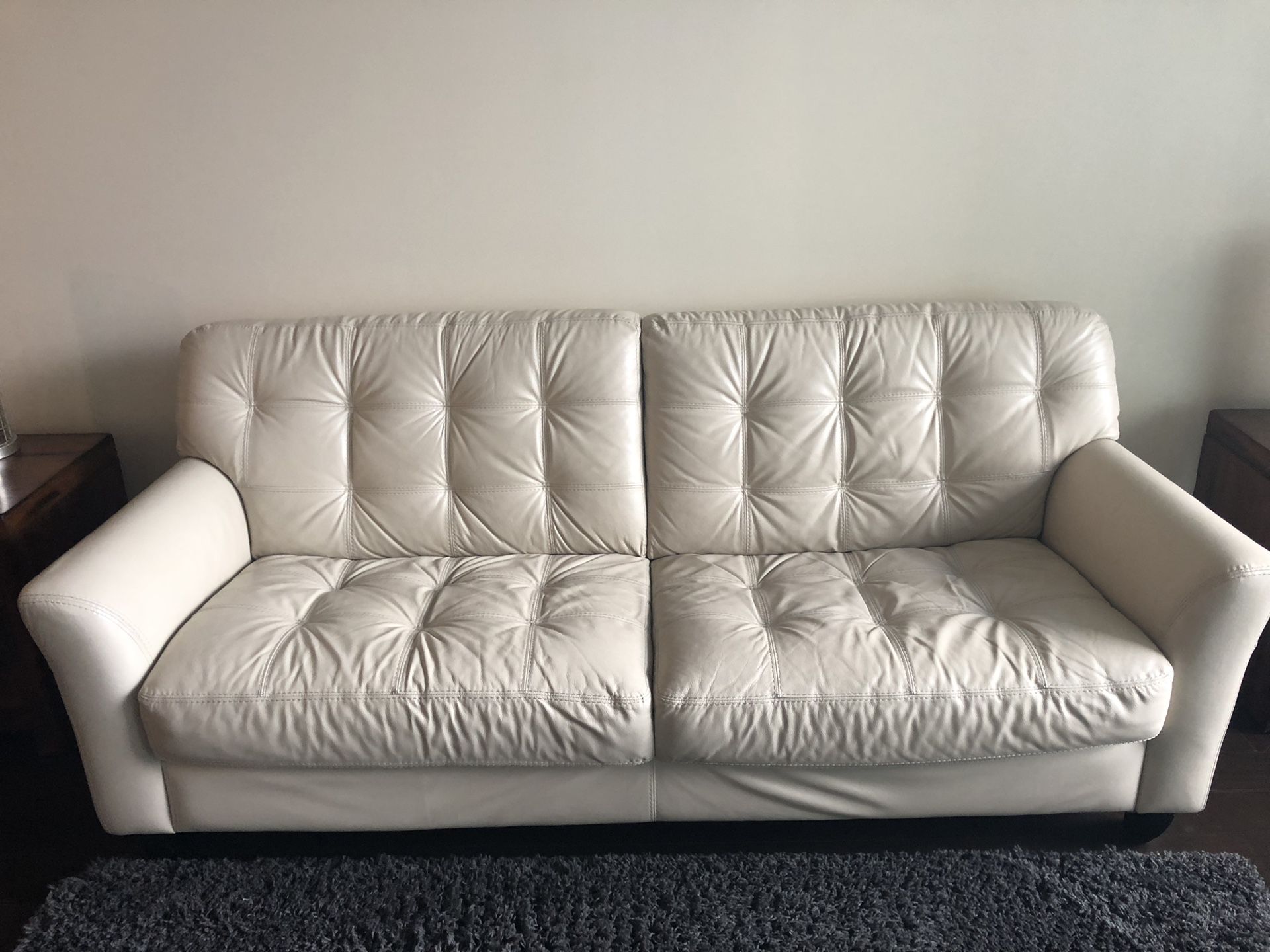 Ivory couch for sale. Recently cleaned and from a non smoking and no pet home.