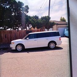 2009 Ford Flex...Mazda 3 2006