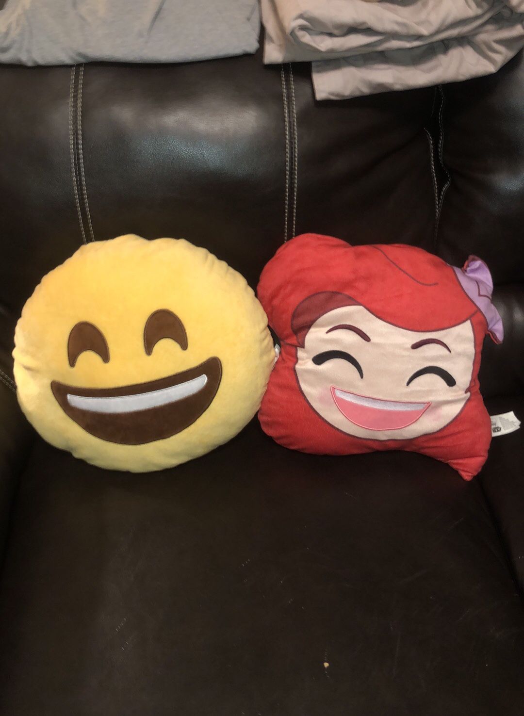 Two MY EMOJI plush throw pillows in excellent condition