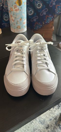 White and light purple Nike sneakers