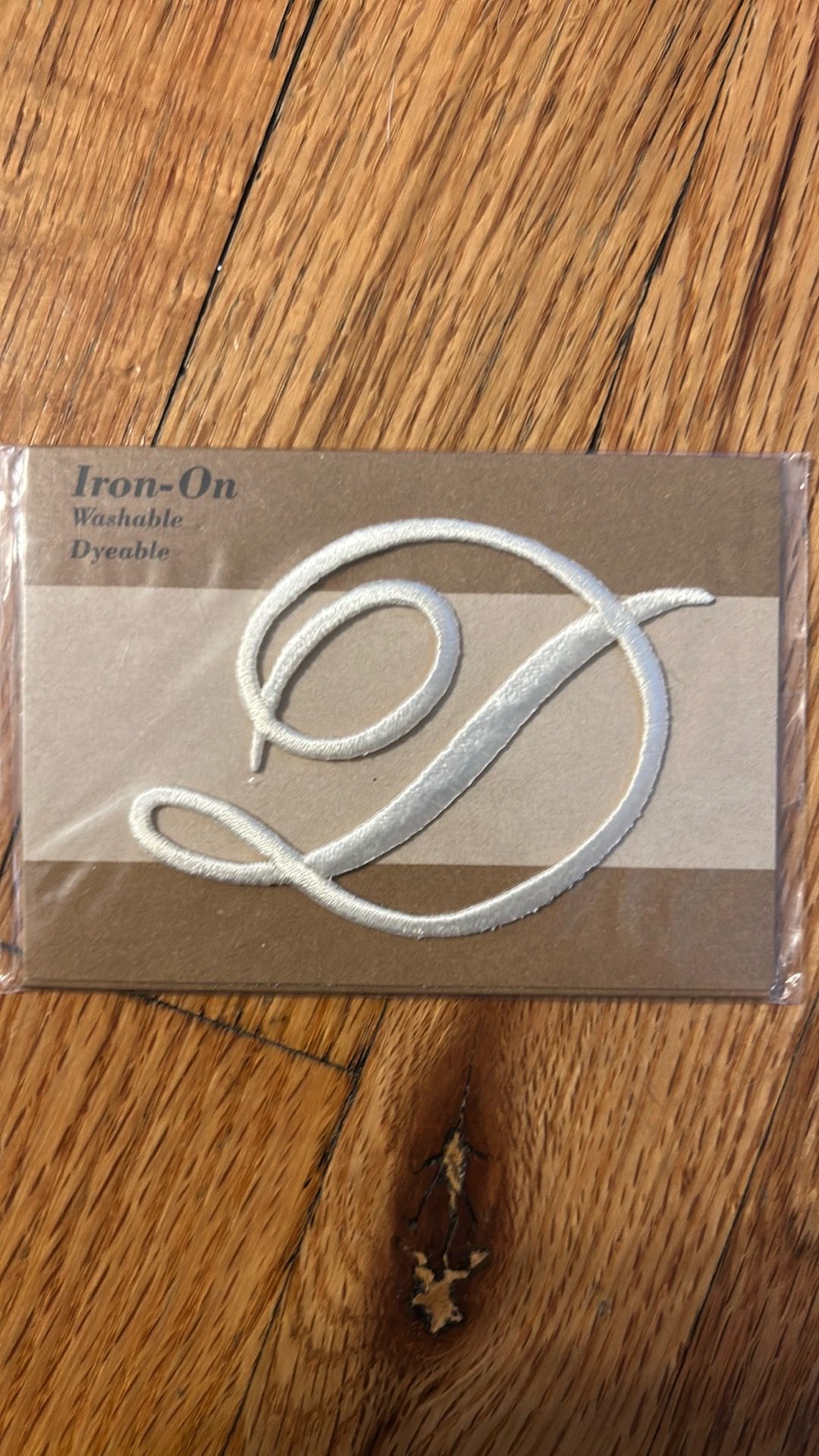 Iron on letter “D” in script. Brand new