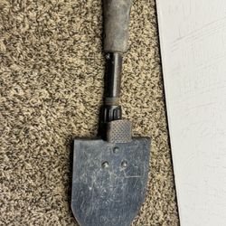 A folding entrenching tool, also known as an "E-tool," is a portable, compact tool used by the military for digging trenches and other earthworks.