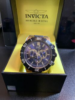 El reloj de la imagen un Invicta Pro Diver Chronograph (Modelo 30729),