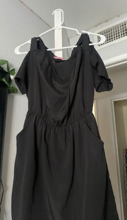 Very unique black dress with pockets and detailed sleeves