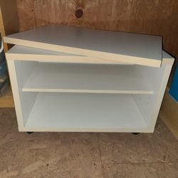 Swiveling Table with Shelves