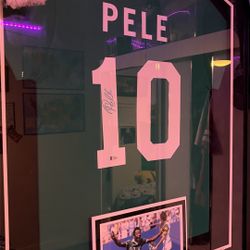 Signed and game worn and Pele Jersey 