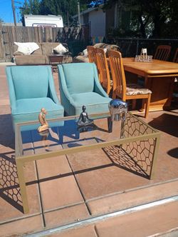 2 blue chairs and center table