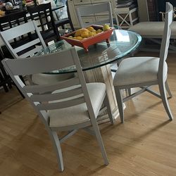 Glass dining room table with 4 chairs