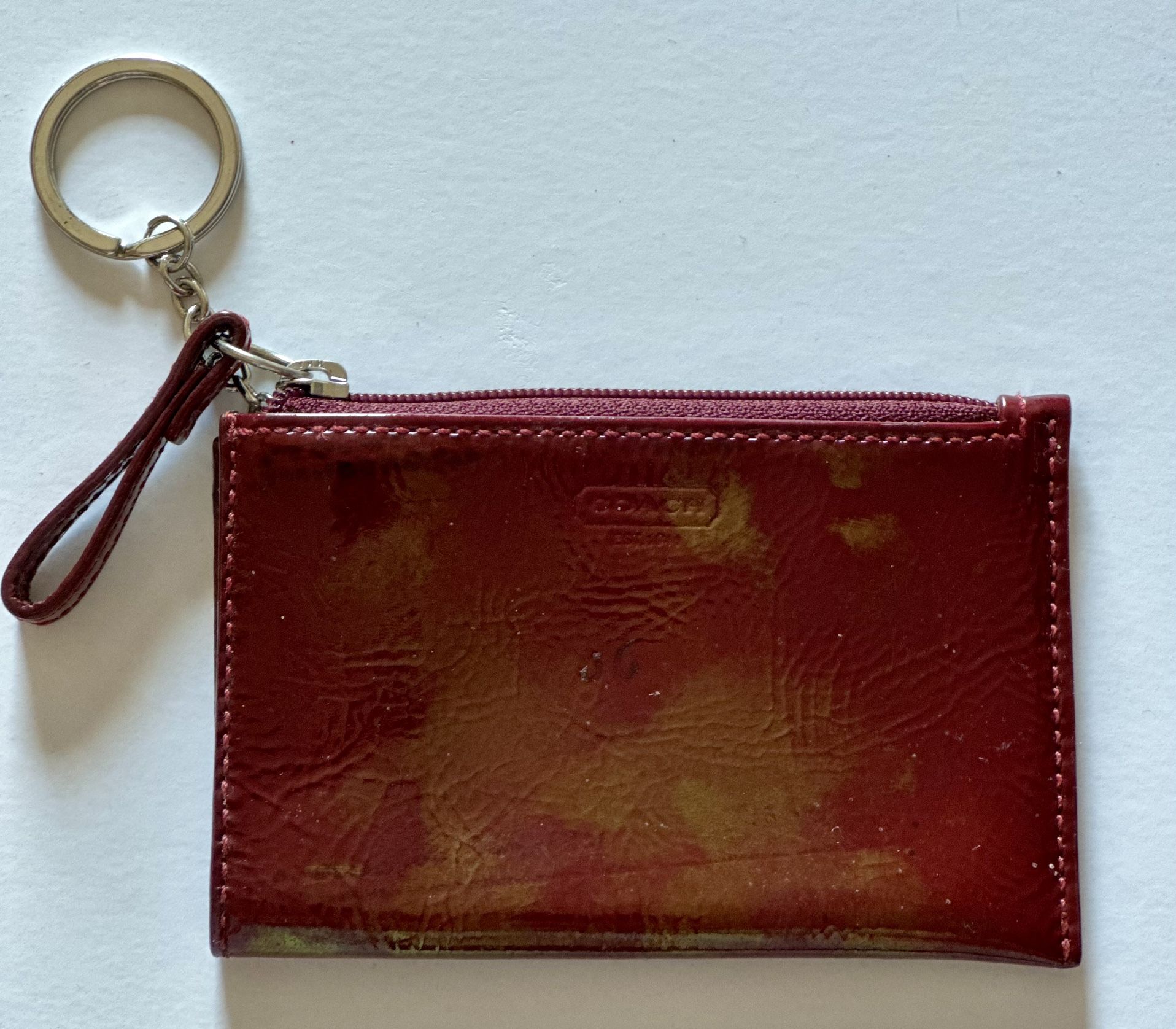 Used - 100% authentic Coach patent maroon keychain wallet