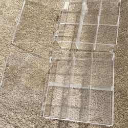 2 pieces of $19 acrylic watch, jewelry, and accessory storage boxes with multiple compartments and large capacity.
