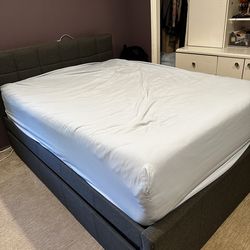 Grey fabric headboard and frame with twin trundle