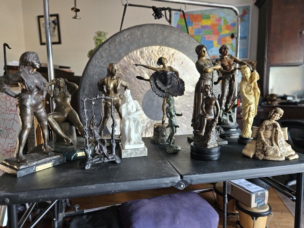 Collection of bronze, marble, spelter, and resin statues.