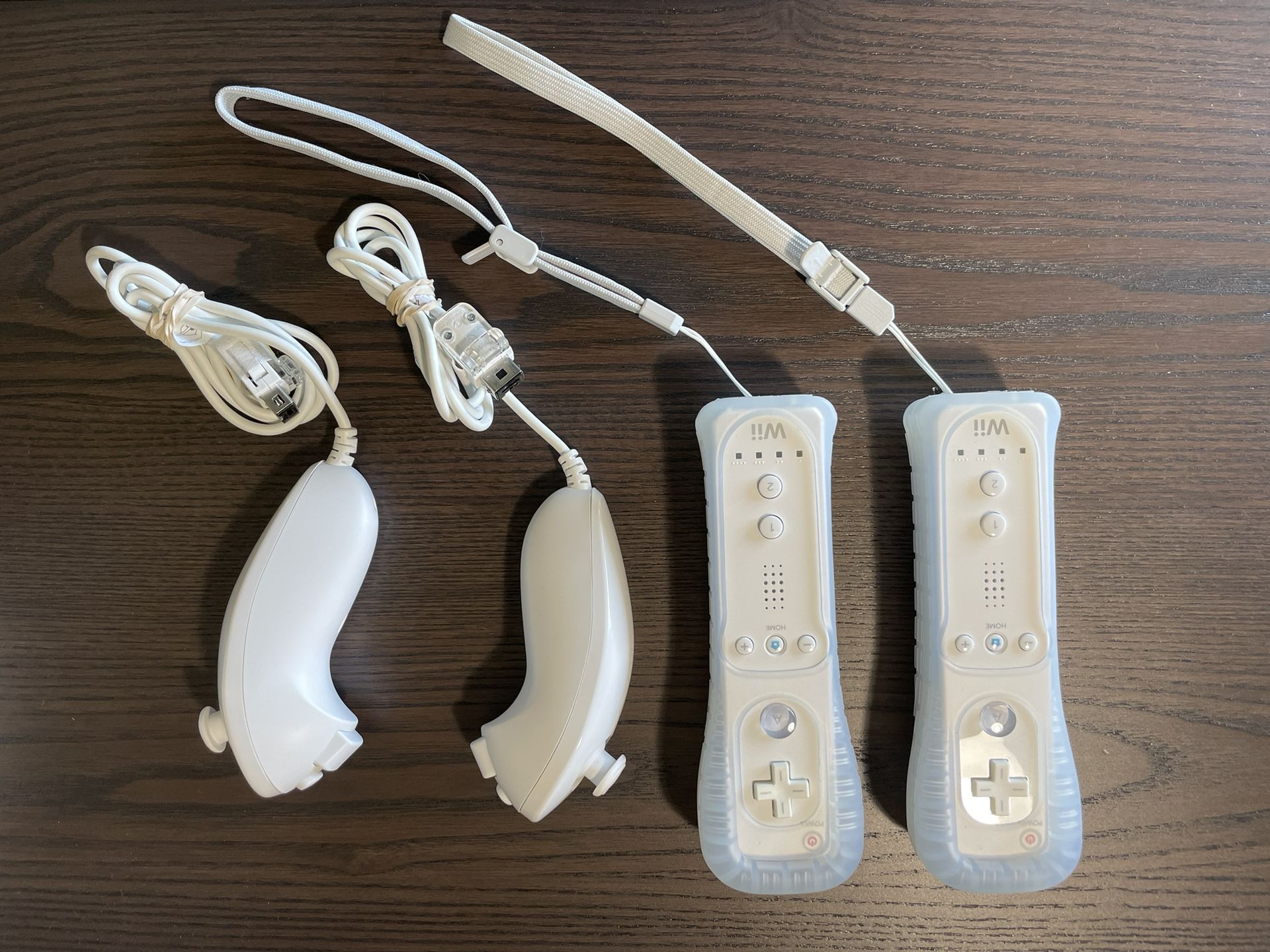 $40 For Two OEM Nintendo Wii / Wii U Remotes With Nunchucks And Silicon Cases