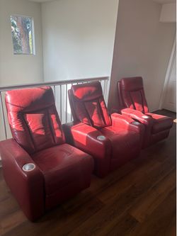 Three matching home theater recliners upholstered in red leather!