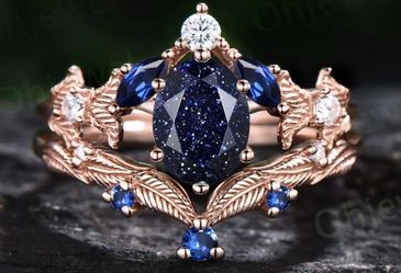 18 karat rose gold engagement ring with Saphire Gem