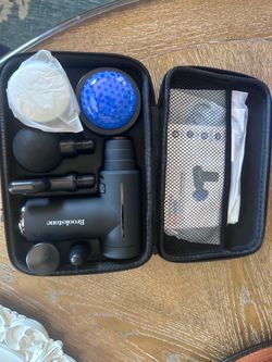 Brookstone Cordless Hot and Cold Percussion Deep Tissue Massage Gun with 6 Intensity Levels for Muscle Relief