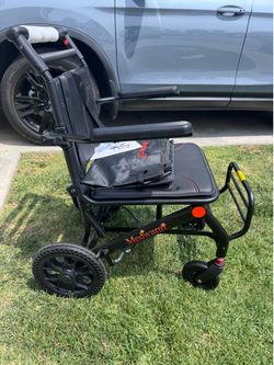 Transport Chair- Teen to Adult size weight max 220 lbs. brand new. ( armrest, foot tray)