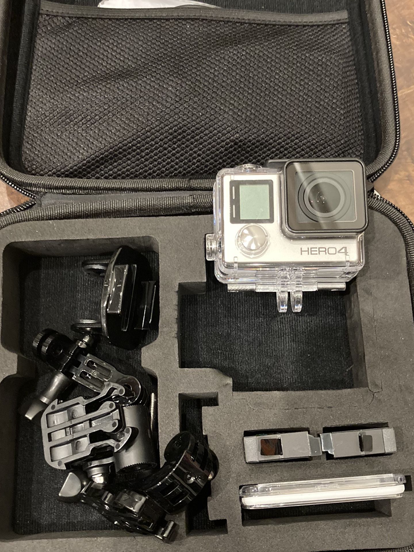 GoPro Hero 4 Silver with case, suction mount, charger, and extra batteries