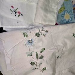 LOT of vintage linens. mostly pillow cases, some handkerchiefs and 2 table clothes