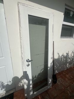 Hurricane glass door with frame.