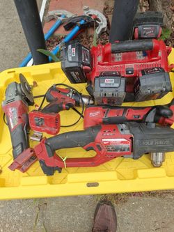 Milwaukee rechargeable grinder, compact drill and milty tool.