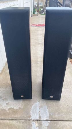 Two long stand jbl speakers