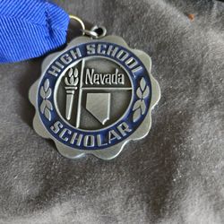The Honor Society of Phi Kappa Phi medallion and Nevada honor society
