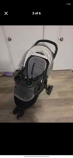 Graco Modes 3 Lite DLX Travel System featuring SnugRide