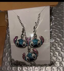 Brand new 3 piece Stitch Necklace and pair of Pierced Earrings