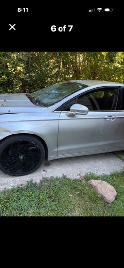 Silver Sedan with Black Custom Wheels