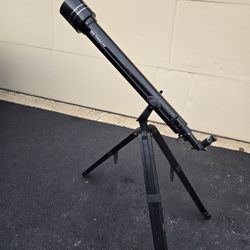 Tasco telescope mounted on a sturdy tripod.