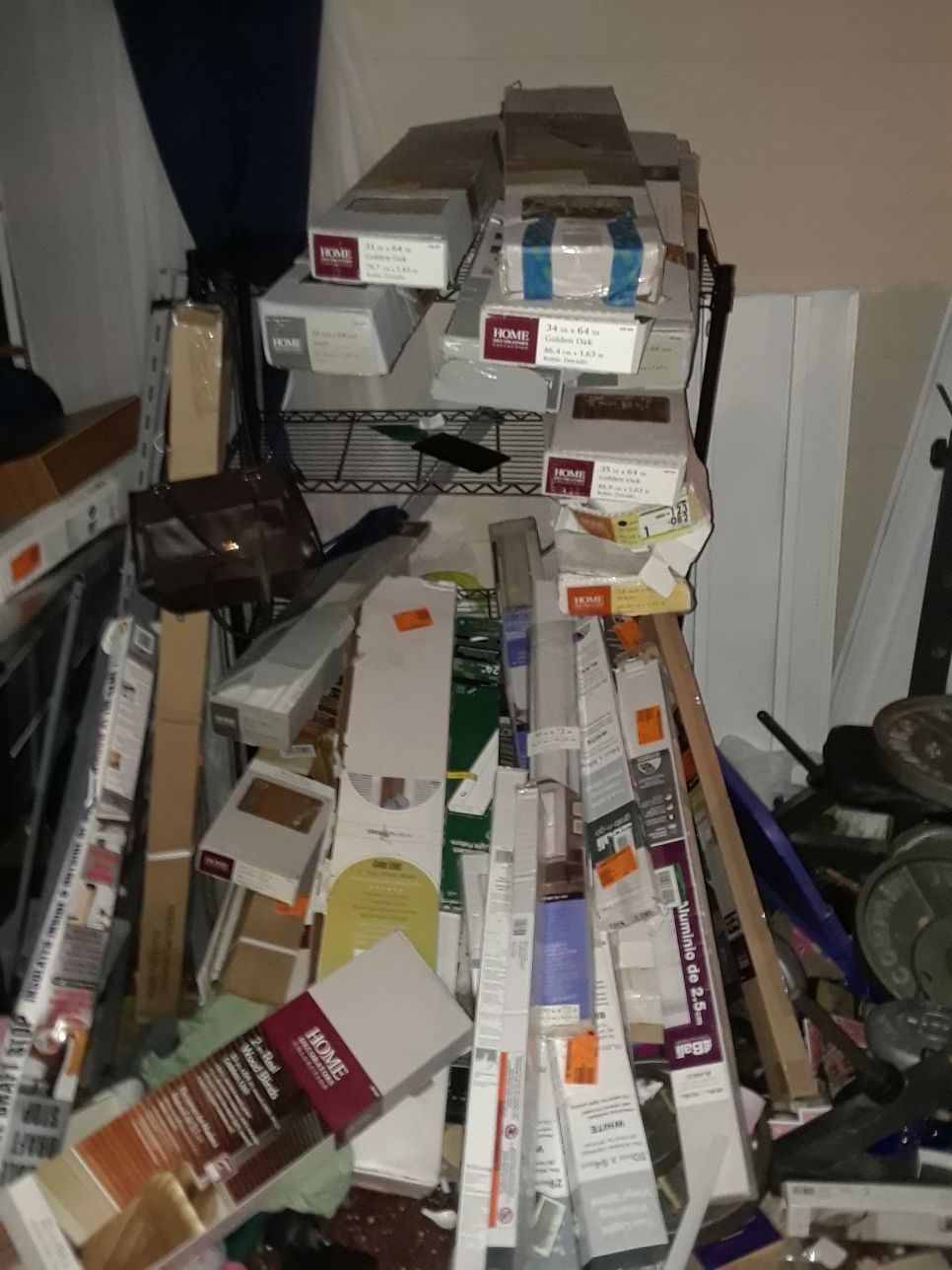 Shelf full of home depot return blinds