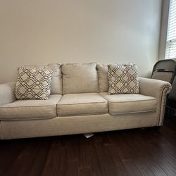 Ashley Beige Upholstered Sofa with Nailhead Trim
