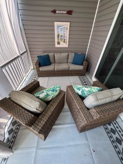 Broyhill wicker sofa and two swivel chairs