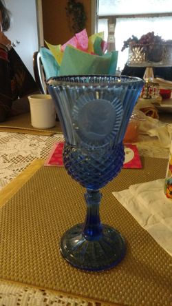 Avon stem ware glass set of six looks like a picture of president Washington on each