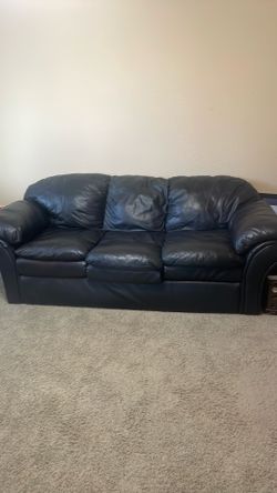Faux leather sofa and matching chair