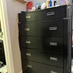 Tall black dresser