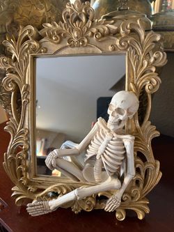 Ornate Gold Mirror with Skeleton Figure