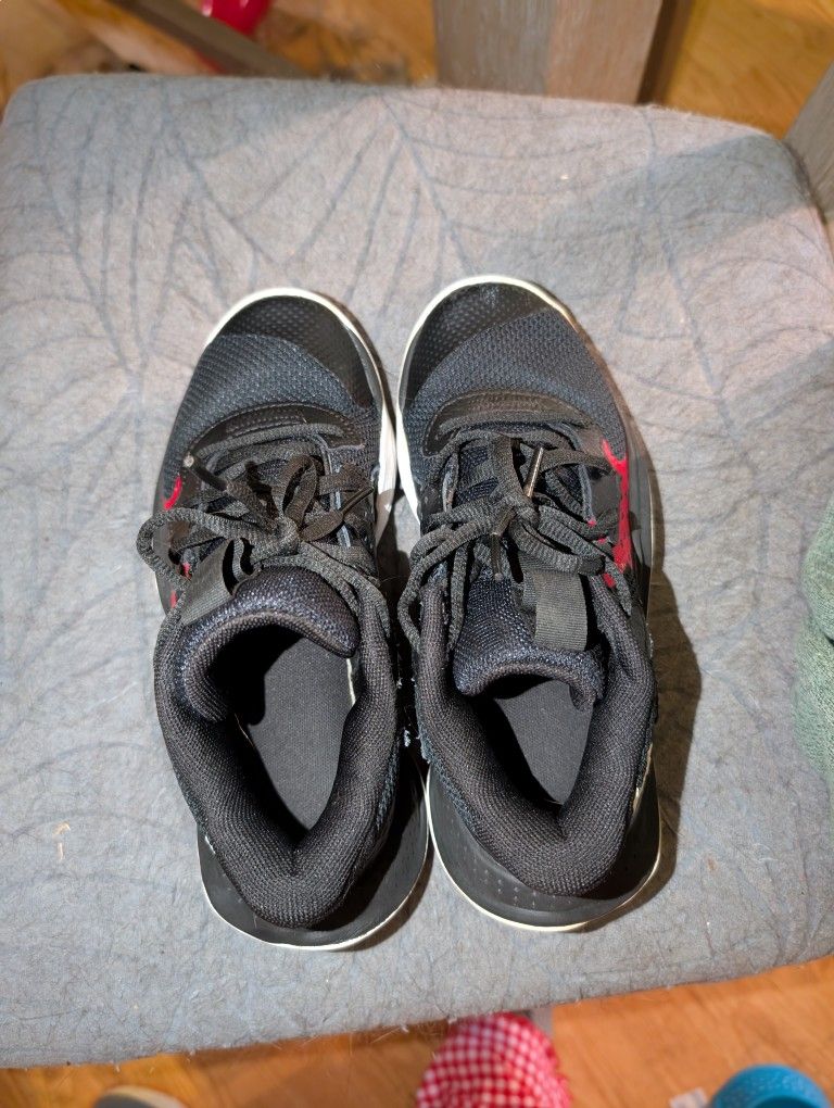 Black and red Under Armour Basketball Shoes