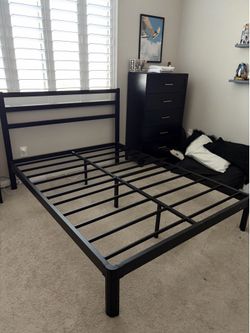 Black metal queen bed frame
