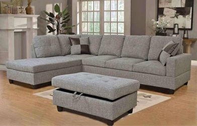Gray linen sectional couch and ottoman