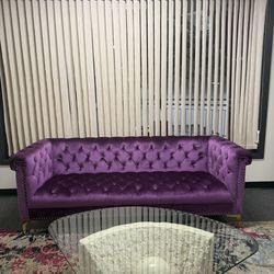 Purple couch with two matching chairs